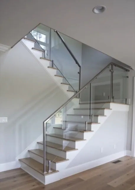 Glass-panel staircase with oak treads in Seattle